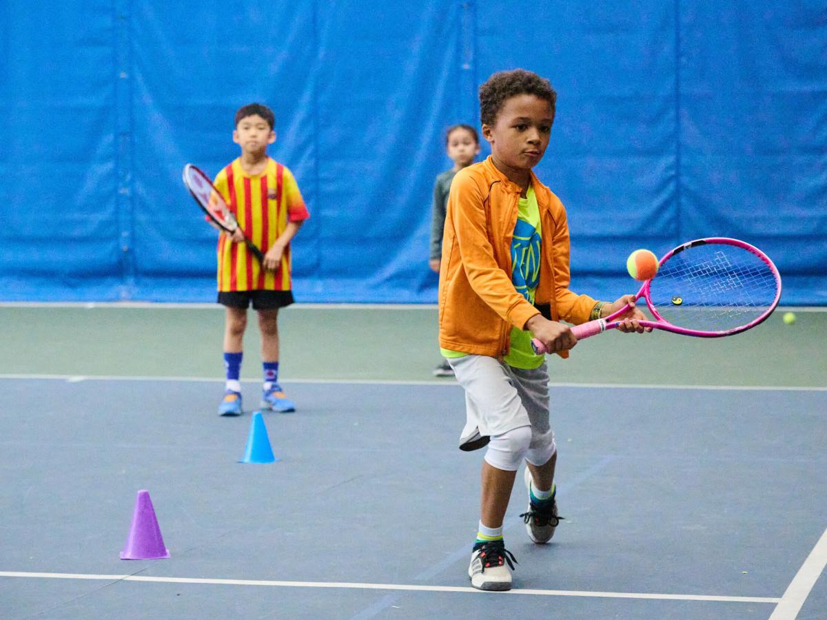 Boy playing tennis