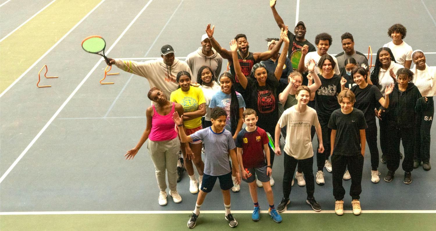 HJTEP Kids and coaches group on court, all looking up at camera